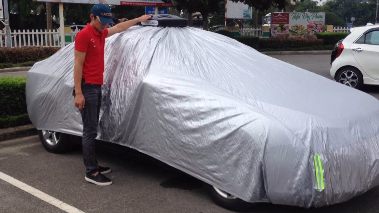 Dùng bạt phủ cho xe khi mưa nắng